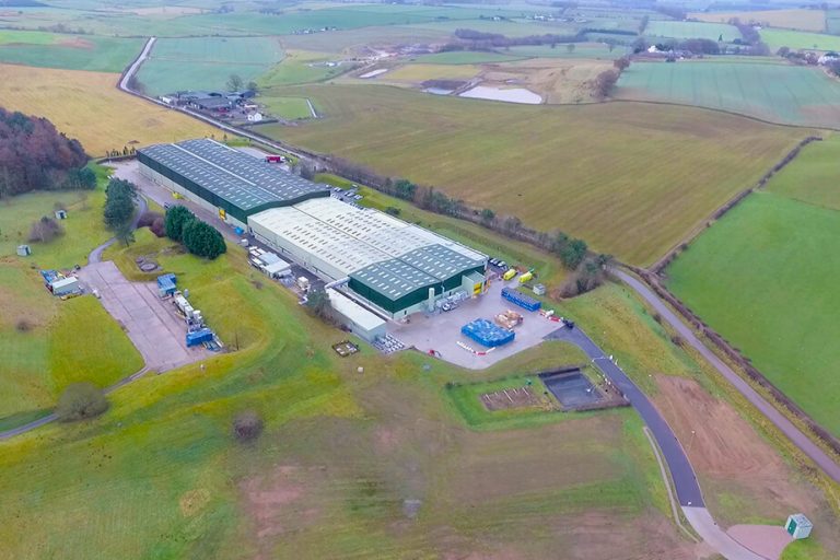 ariel-view-of-a-factory-in-the-middle-of-a-field