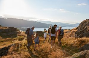 family-walking-to-have-a-picnic-at-aira-force-in-the-lake-district