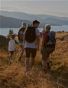 family-walking-to-have-a-picnic-at-aira-force-in-the-lake-district