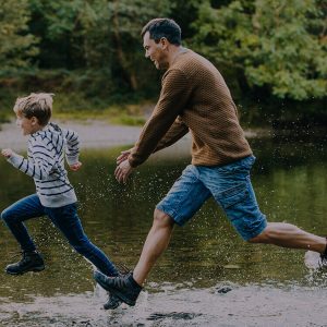 farther-and-son-running-through-puddles-in-the-lake-district