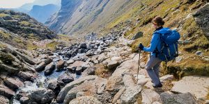 female-walker-scrambling-down-a-fell