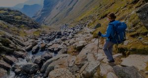 female-hiker-scrambling-down-a-fell-in-the-lake-district