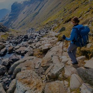 female-hiker-scrambling-down-a-fell-in-the-lake-district