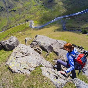 female-hiker-walking-down-a-steep-fell