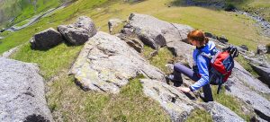 female-hiker-walking-down-a-steep-fell